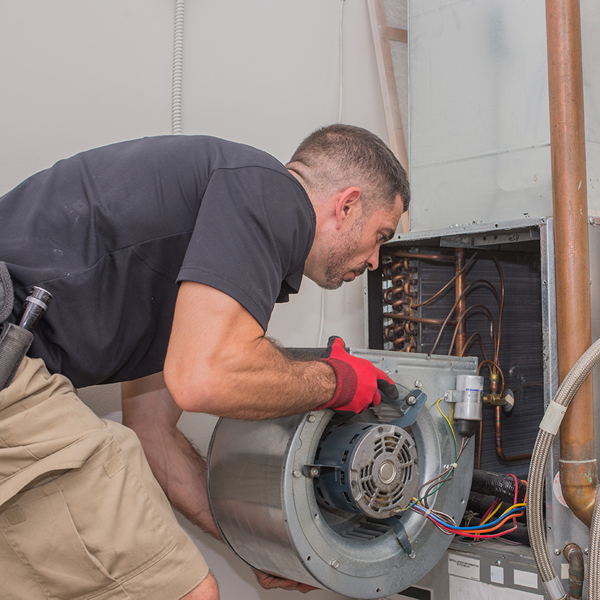 An image of an HVAC contractor at work, from leads generated from their digital marketing team.